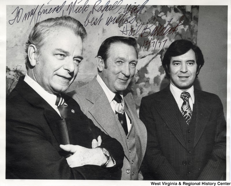 From left to right: Senator Robert C. Byrd; Hal Burdick, publisher of Huntington Herald-Dispatch; and Congressman Nick Rahall II. The photograph is signed 'To my friend, Nick Rahall - with best wishes. Hal Burdick. 12/7/77'